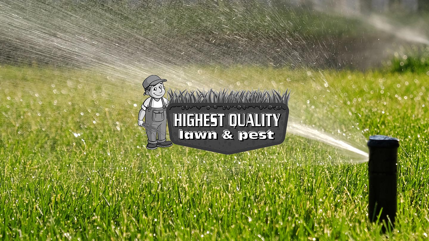 Green lawn with sprinklers with Highest Quality Lawn and Pest logo in center